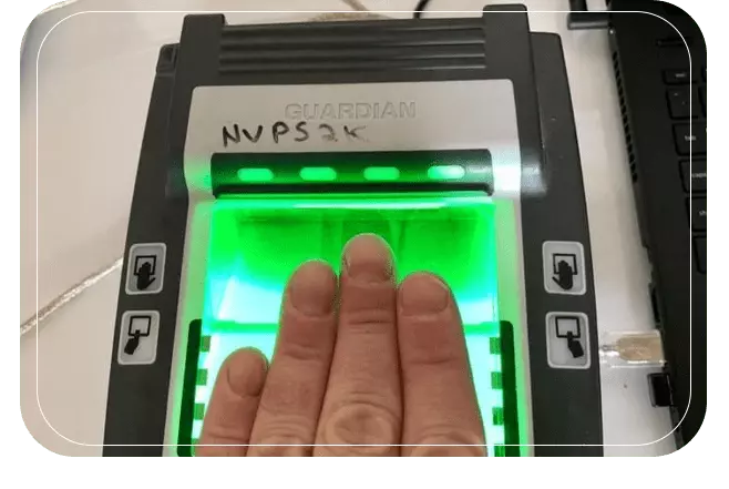 A fingerprinting machine scanning four finger